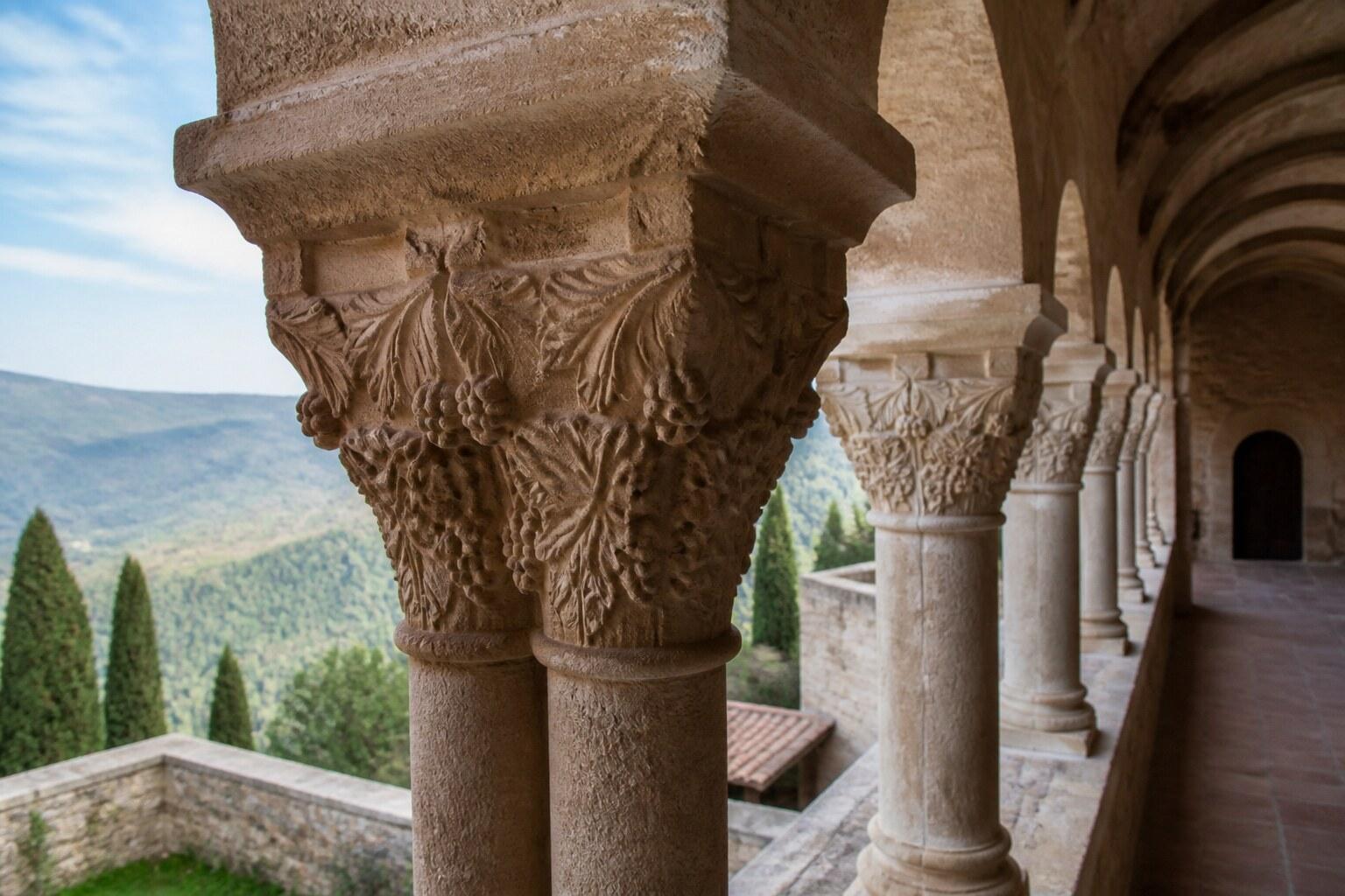 Carved stone column and cloister at Santuari del Miracle